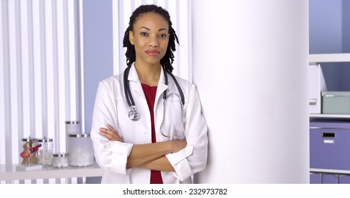 Successful African Woman Doctor Standing In Office