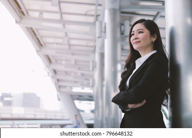 Successful Asian Senior Businesswoman Leader Standing Over Modern Office Background, Copy Space