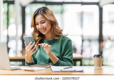 Successful asian woman entrepreneurs using mobile start up grow their businesses with mobile, application and technology concept. - Powered by Shutterstock