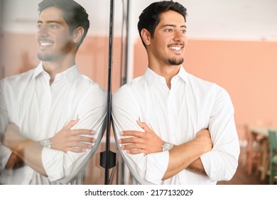 Successful Authoritative Confident Young Bearded Brunet Adult Male Entrepreneur Businessman Professional In Formal Wear Standing With Arms Crossed At The Modern Home Office, Looking Away