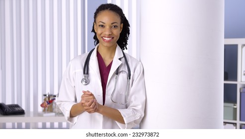 Successful Black Woman Doctor Smiling In Office