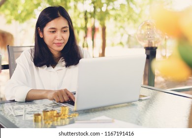 Successful Business Girl Make Money From Home With Laptop Computer And Money On Desk.Online Business Concept