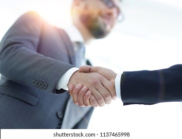 Successful Business People Handshaking After Good Deal.