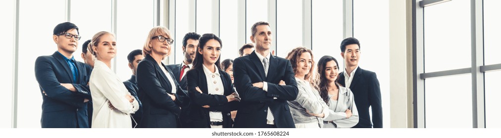 Successful Business People Standing Together Showing Strong Relationship Of Worker Community. A Team Of Businessman And Businesswoman Expressing A Strong Group Teamwork At The Modern Office.