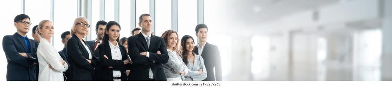 Successful Business People Standing Together Widen Out Showing Strong Relationship Of Worker Community. A Team Of Businessman And Businesswoman Expressing A Strong Group Teamwork At The Modern Office.