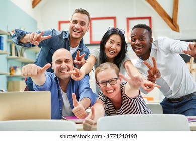 Successful business start-up team with thumbs up is happy - Shutterstock ID 1771210190