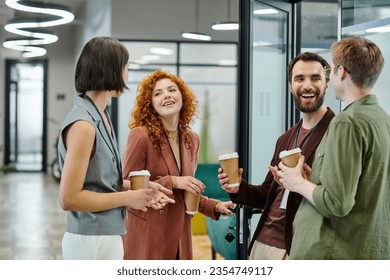 successful business team with paper cups smiling and talking during coffee break in office - Powered by Shutterstock