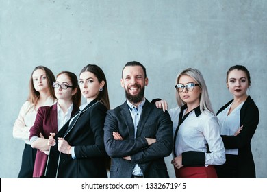 Successful Business Teamlead. Solid Team Of Corporate Professionals. Copy Space On Grey Background.