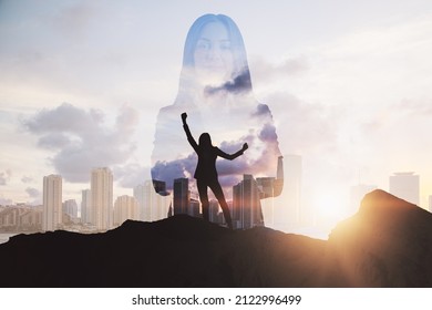 Successful business woman on mountain top. Leadership and future concept. Abstract city background with sunlight and silhoutte. Double exposure