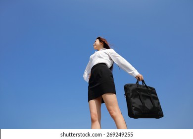 Successful Business Woman Purposefully Looking Away With Blue Sky, Asian Beauty