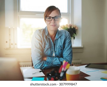 Successful Business Woman Working At The Office Looking At Camera