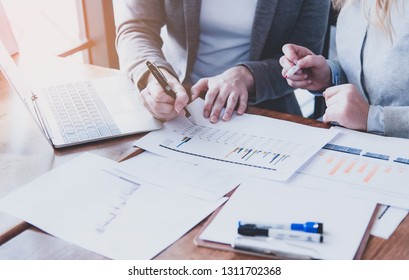 Successful Business Women Analyze The Growth Rate Of Domestic And Foreign Investment From Global Sources With Laptops And Graph Tables That Clearly Show Numbers, Partnership And Teamwork Concept.