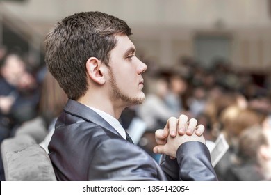 successful businessman listens to the report sitting in the conference room.
