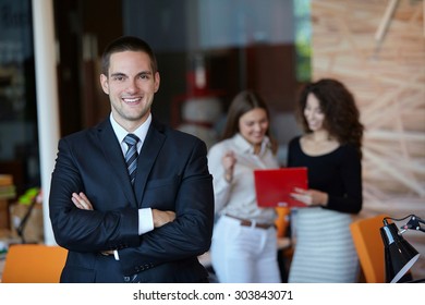 Successful businessman at the office - Shutterstock ID 303843071
