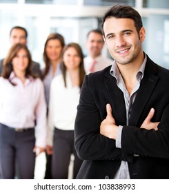 Successful Businessman At The Office Leading A Group