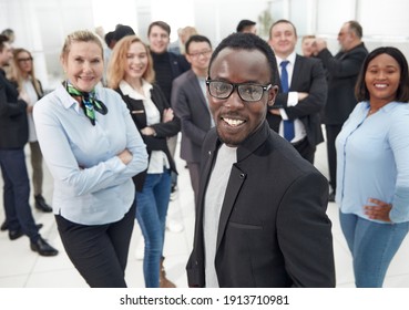 Successful businessman at the office leading a group