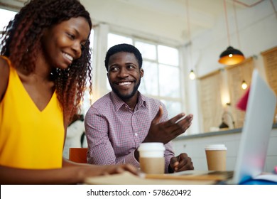 Successful businessman pointing at laptop display during presentation - Shutterstock ID 578620492