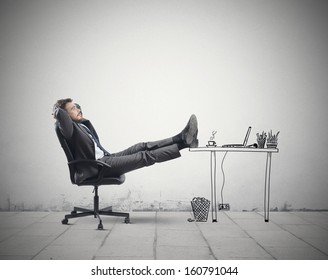 Successful Businessman Relaxing In An Imaginary Office