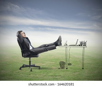 Successful Businessman Relaxing In An Imaginary Office