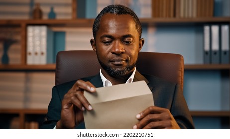 Successful Businessman Sits In Office Opening Paper Envelope Reading Letter With Good News Received Bank Loan Approval Profitable Proposition Happy Man Gets Promotion Career Advance Great Opportunity