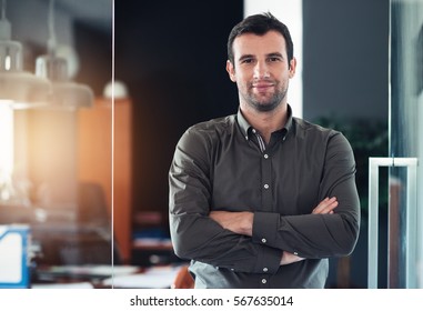 Successful Businessman Standing In His Office