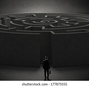 Successful businessman standing near the entrance of labyrinth - Shutterstock ID 177875555