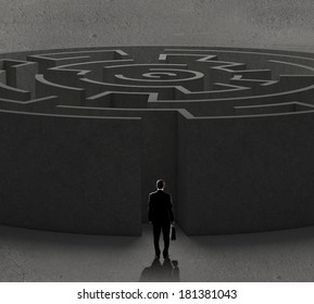 Successful businessman standing near the entrance of labyrinth - Shutterstock ID 181381043