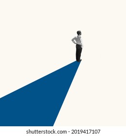 Successful businessman standing on blue line, way or path to success and goal. Right direction. Concept of finance, economy, professional occupation, business and career.