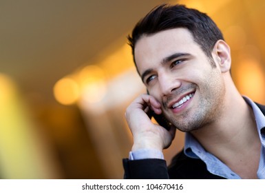 Successful Businessman Talking On Her Cell Phone