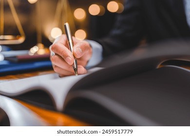 Successful businessmen's hand putting signing contract or agreement form, Lawyers or attorneys sign approval document, concept of justice, corporate, justice and rights, insurance, court and authority - Powered by Shutterstock