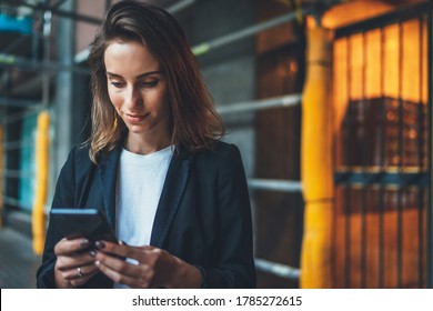 Successful Businesswoman Checks Email On Smartphone During A Lunch Break Outside Office, Manager Uses Mobile Phone In City Outdoors, Women In Suit Writes  Message On Cellphone