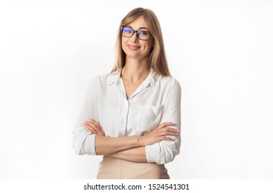 Successful Businesswoman. Positive Lady Smiling At Camera Standing Crossing Hands On White Studio Background. Isolated