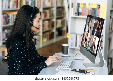 Successful Caucasian Woman Manager Or Call Center Worker In Headphones Communicates Online By Video Conference With Her Colleagues Or Clients About Important Working Moments