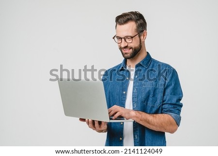 Successful caucasian young man student freelancer using laptop, watching webinars, working remotely, e-learning e-commerce online isolated in white background
