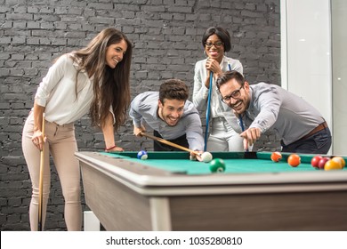 Successful cheerful business people playing snooker. - Powered by Shutterstock