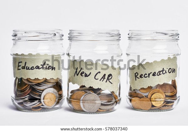 Successful coin jar. Please give generously. Coins
in a glass jars.