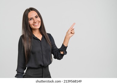 Successful confident smart caucasian young businesswoman freelancer boss CEO bank manager worker employee looking at camera pointing at copy space in formal clothes isolated in white - Shutterstock ID 2139568149