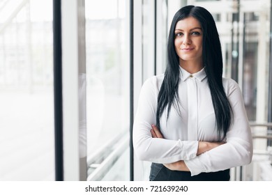 Successful Confident Young Business Woman In An Office Setting