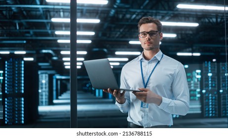 Successful Creative Director Working on Laptop Computer in Big City Office Late in the Evening. Male Business Analyst Preparing for a Meeting Discussion About Project Management Report. - Shutterstock ID 2136788115