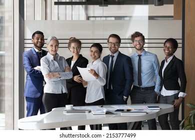 Successful diverse business team of multiethnic employees corporate portrait. Group of happy coworkers, students, interns, mentors standing, looking at camera, smiling. Teamwork, diversity concept