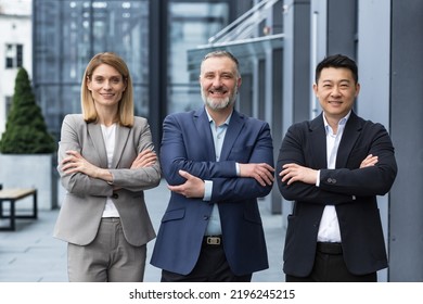 Successful Dream Team, Diverse Business Group Of Asian Man And Business Woman Smiling And Looking At Camera, Colleagues With Crossed Arms Outside Office Building, Professionals Investors And Bankers