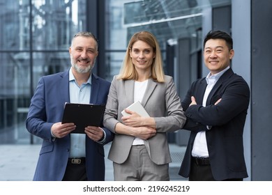 Successful Dream Team, Diverse Business Group Of Asian Man And Business Woman Smiling And Looking At Camera, Colleagues With Crossed Arms Outside Office Building, Professionals Investors And Bankers