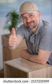 Successful Furniture Assembly Worker Shows Thumbs Up