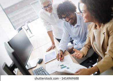 Successful group of business people at work in office - Shutterstock ID 1414969688
