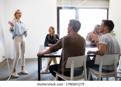 Successful group of designers, business people at work in office - Shutterstock ID 1780691279