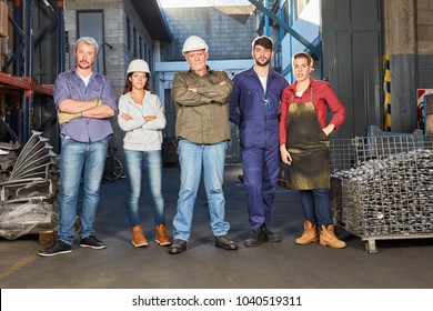 Successful group or team of blue collar workers as colleagues - Shutterstock ID 1040519311