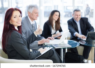 Successful Happy Business People Using Laptop And Talking About A Work. Shallow Depth Of Field. Please See More Photos And Video ( Business Concepts ). 