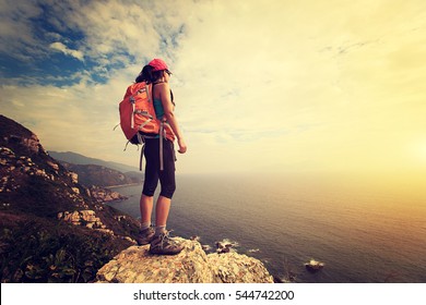 Successful Hiker Hiking On Seaside Mountain Peak