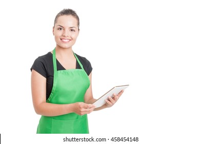 Successful Hypermarket Employee With Green Apron Holding Modern Tablet Isolated On White Background With Copyspace