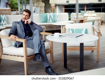 Successful Intelligent Business Man Relaxing In A Luxury Restaurant Outdoors, Confident Thoughtful Entrepreneur, Wealthy Men Pensive Rest And Waiting Someone In The Modern Coffee Shop Terrace